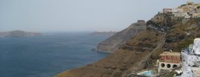 Exploring the famous blue and white homes of Santorini while traveling in Greece