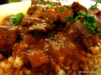 Spicy Pork over couscous at Portes